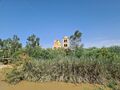 Several churches at both sides of the Jordan River, cc0.