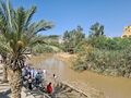 Bethabara at Jordan River (west) where Jesus was baptised (according to Matthew) as ceremonial place and with a church visible at the east side of the river, CC0.